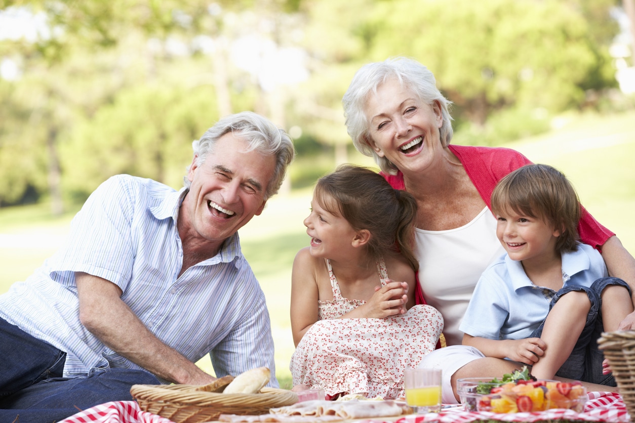 Grandparents and their grandchildren having a picnic