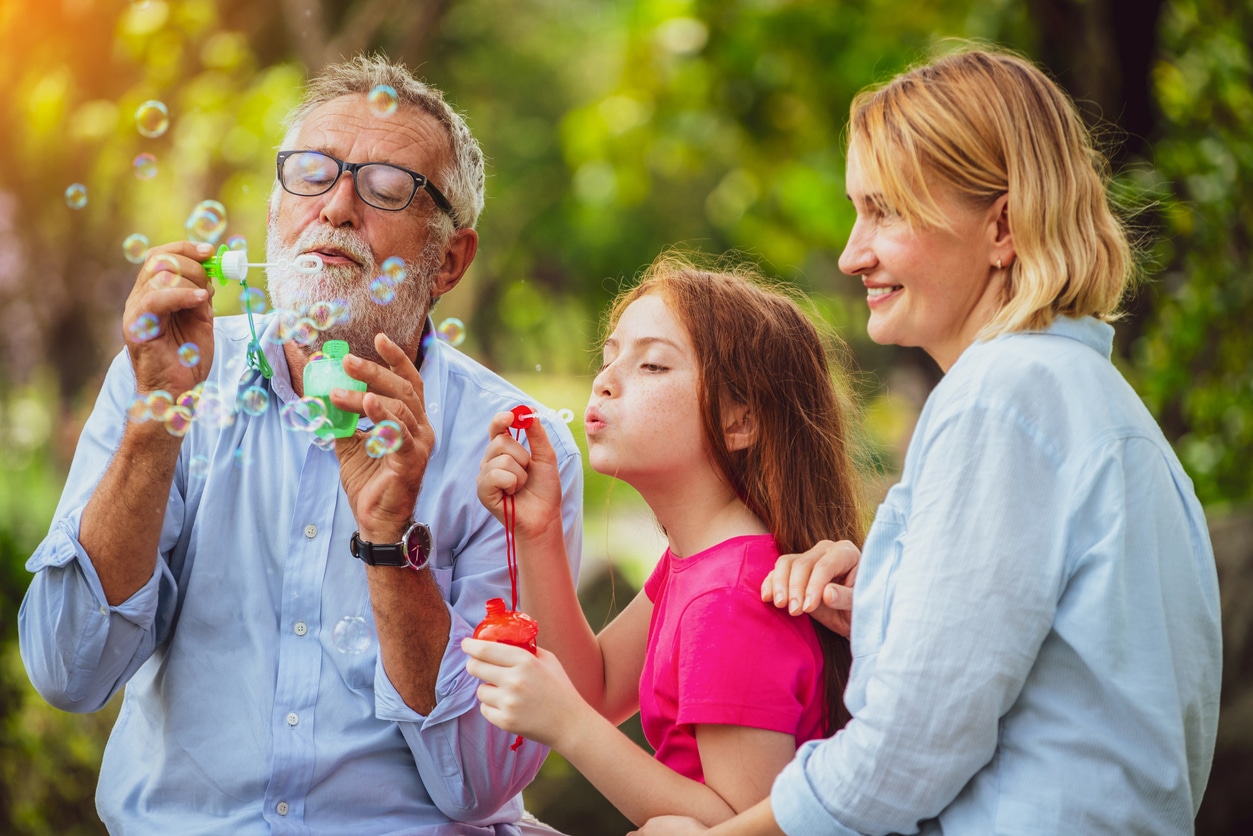 Family blowing bubbles