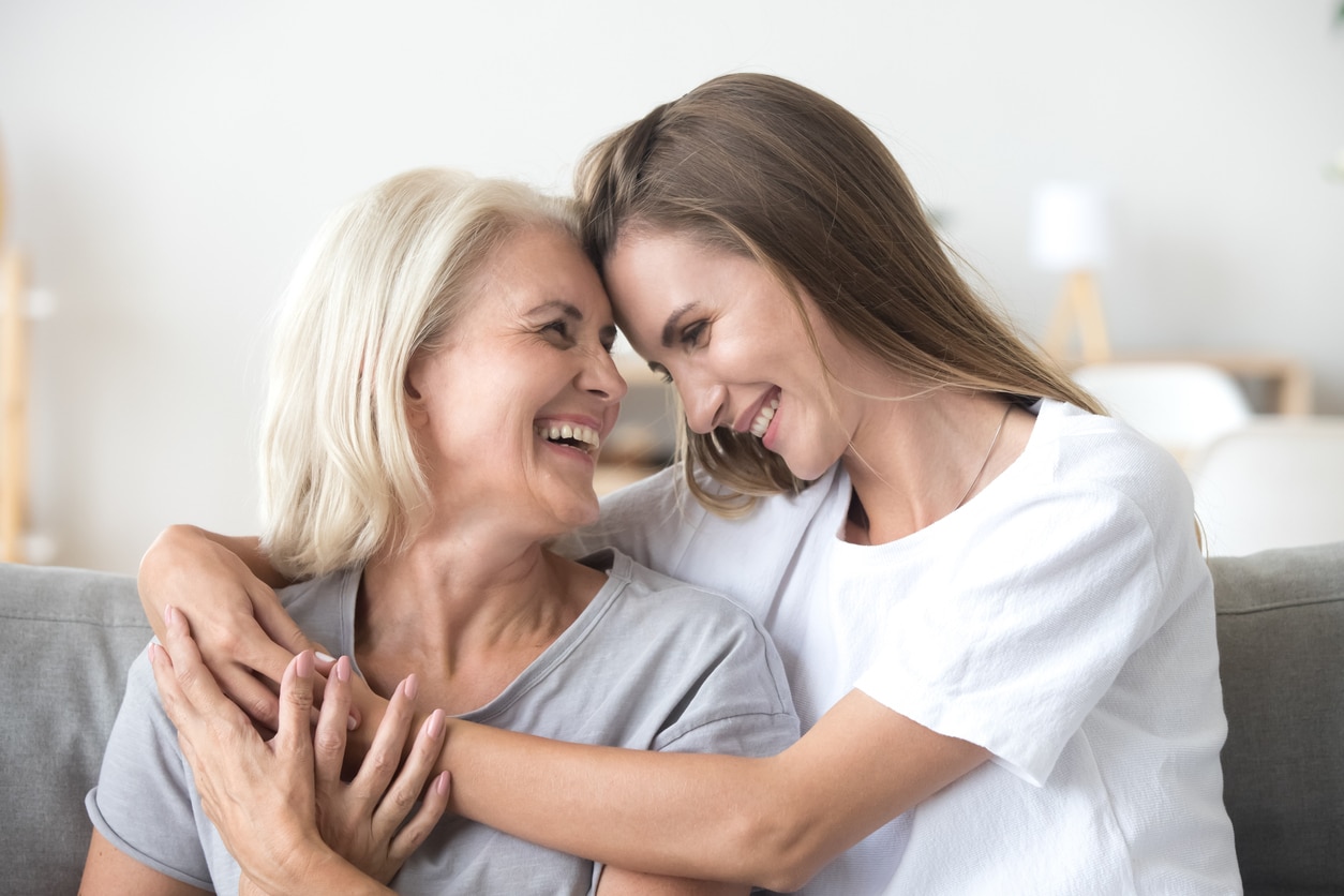 Mother and daughter hugging