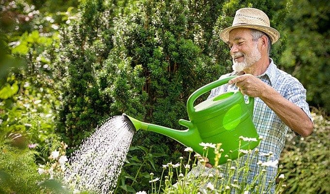 man with watering can