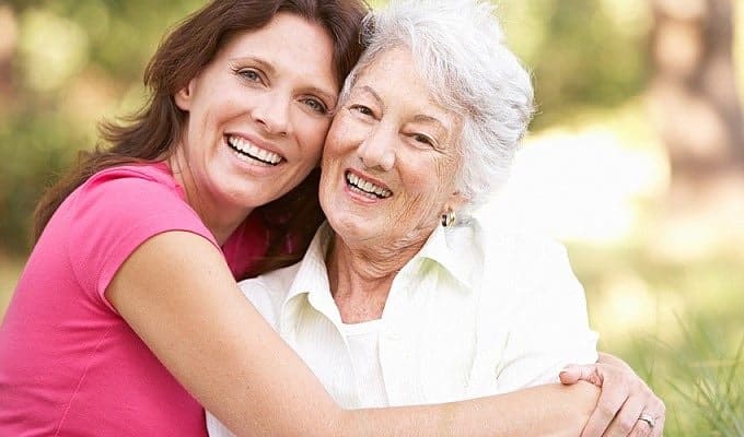 women hugging outside