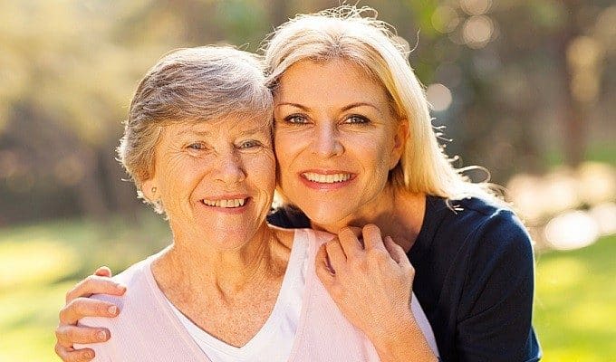 mother and daughter smiling