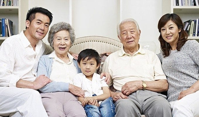 family sitting on couch