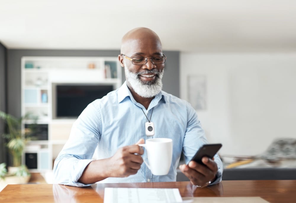 Man with coffee wearing On the Go mobile solution