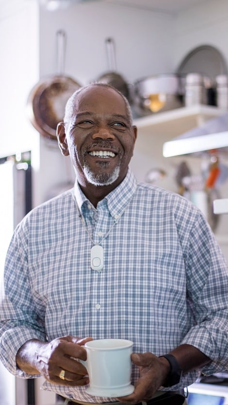 Man with HomeSafe drinking coffee