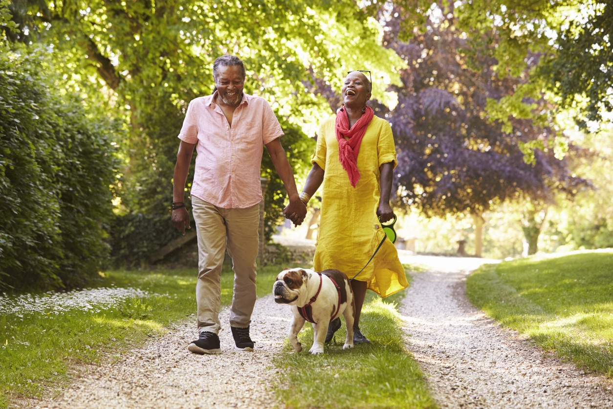 Couple walking dog