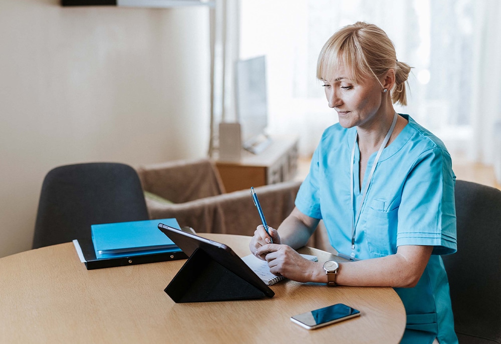 Healthcare Worker Reviewing Dashboard