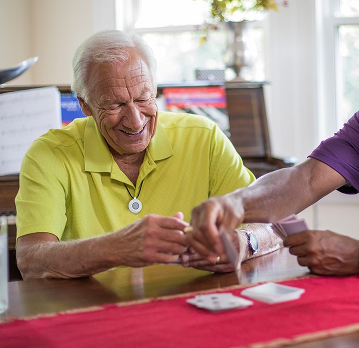 Man wearing HomeSafe playing cards