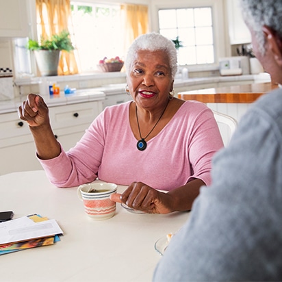 Woman Drinking Tea with Husband