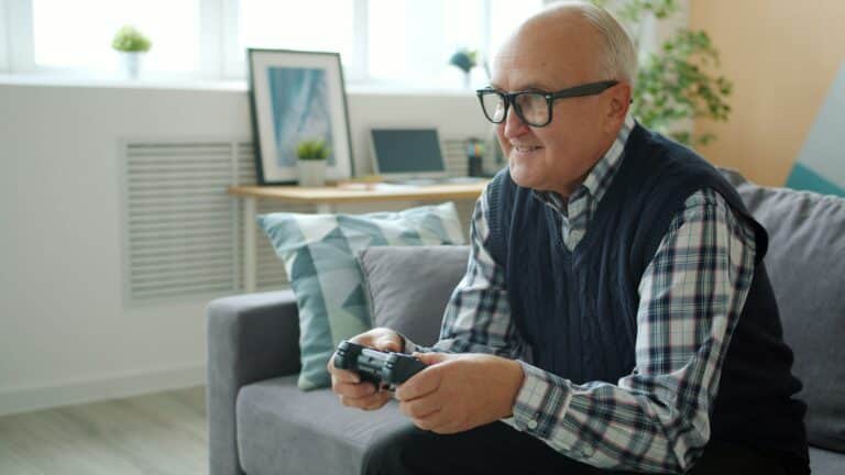 Senior playing video game