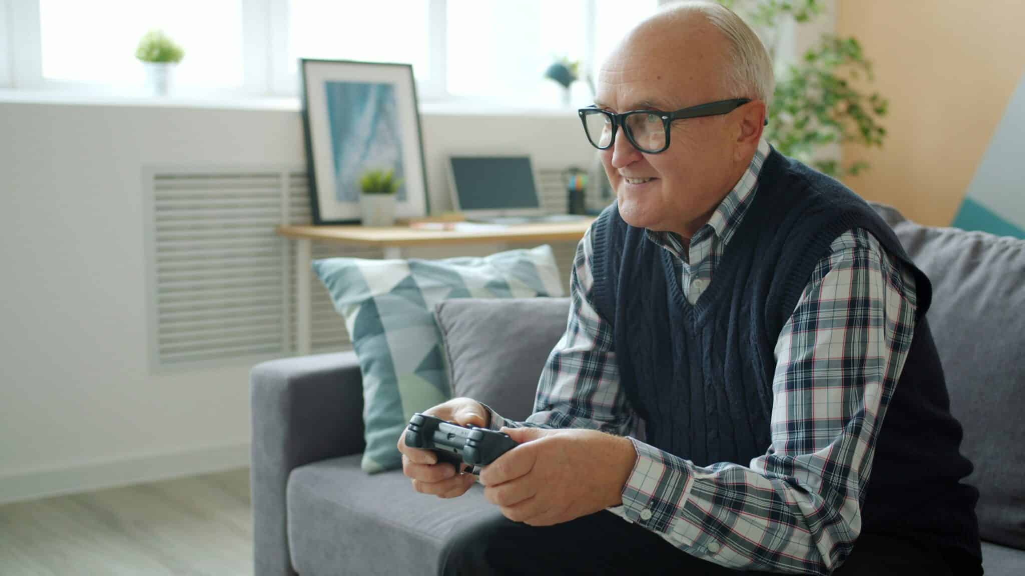 Senior playing video game