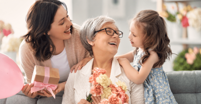 Sandwich generation caregivers spending time with an older parent and child